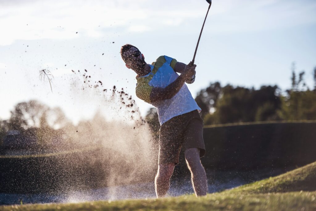 Guy playing golf