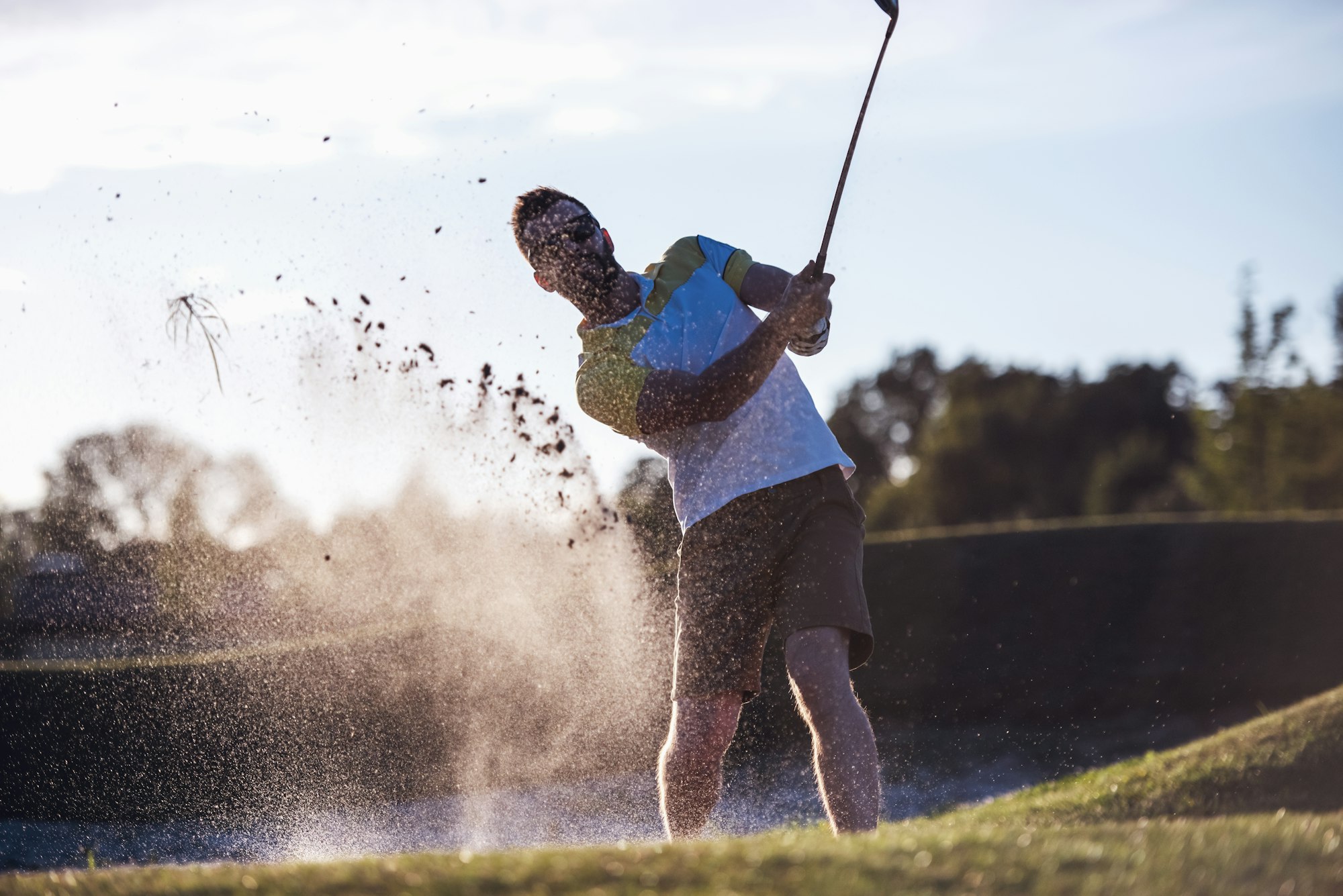 Guy playing golf